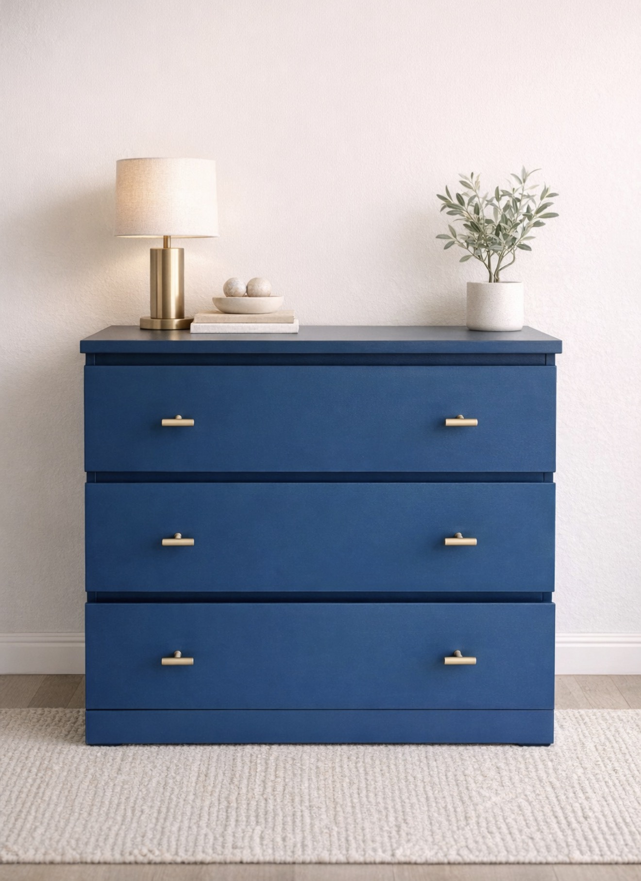 Deep blue dresser restored by Field House Design and staged with warm brass accents
